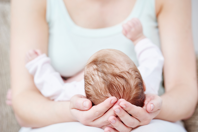 mother holding newborn baby