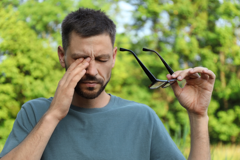 man struggling with seasonal allergies