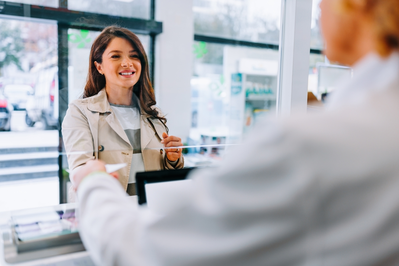 woman picking up meds